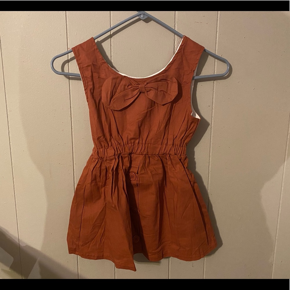 Brown tank with bow on front. Size girls 14.